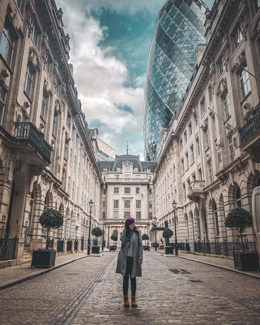 Lone figure in a stone street canyon